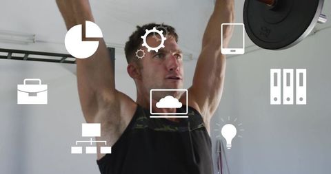 Lifting overhead barbell press in home gym showing strength focus minimalist training