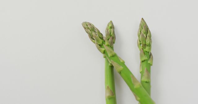 Close-Up of Fresh Asparagus Stalks on White Background - Download Free Stock Images Pikwizard.com