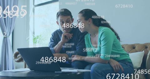 Couple Reviewing Financial Data with Floating Numbers at Home