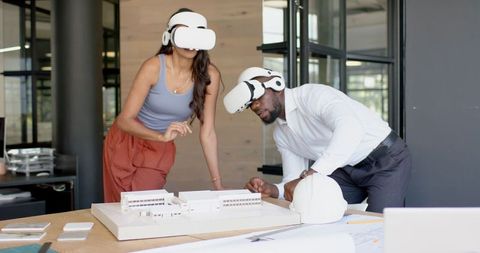 Architects Using VR Headsets for Model Planning in Modern Office