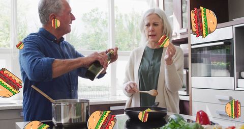 Senior Couple Cooking in Modern Kitchen with Burger Icons - Download Free Stock Images Pikwizard.com