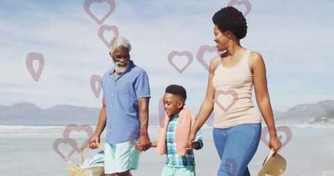 Smiling Family Walking on Beach with Picnic Basket Summery