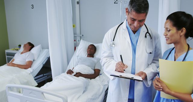 Doctors Providing Care to Patients in Hospital Room - Download Free Stock Images Pikwizard.com