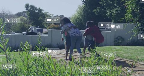 Family playing piggyback on backyard path with social media notifications overlay