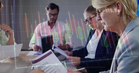 Senior businesswoman reviewing financial report with candlestick chart overlay in team meeting