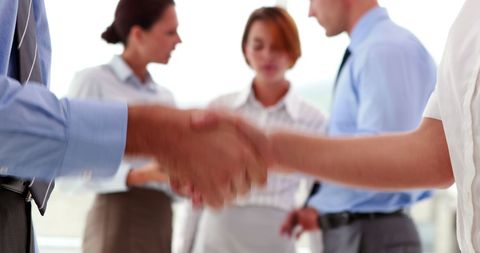 Business People Handshaking in Modern Office Setting - Download Free Stock Images Pikwizard.com