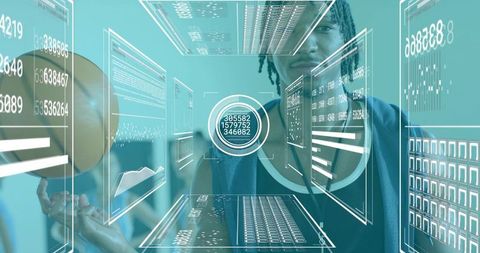 Dreadlocked man holding basketball while interacting with ar data panels and holographic hud