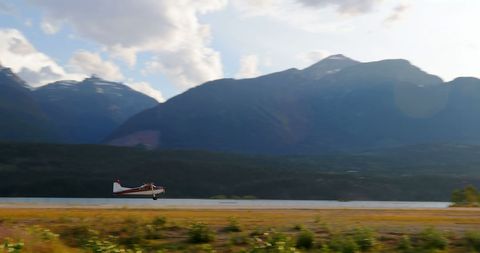 Small Plane Taking Off Amid Majestic Mountain Landscape - Download Free Stock Images Pikwizard.com