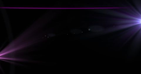 Purple and pink light beams on dark background