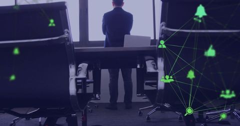 Businessman Reflecting in Modern Office with Digital Network Overlay