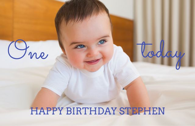 This image shows a cheerful baby lying on a bed, smiling to celebrate their first birthday. Custom text 'One today' and 'HAPPY BIRTHDAY STEPHEN' are prominently displayed. Perfect for designing personalized birthday invitations, keepsake items, or milestone celebration media.
