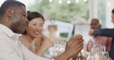 Guests Enjoying Drinks and Conversation at Elegant Wedding Reception