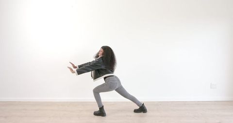 Energetic Dance Poses in Minimalist Studio Space