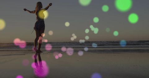 Woman Enjoying Sunset on Beach With Dreamy Light Effects