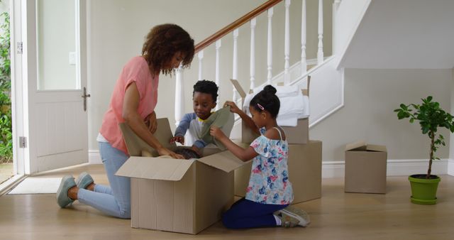 Family Unpacking Moving Boxes in New Home, Creating Comfort - Download Free Stock Images Pikwizard.com