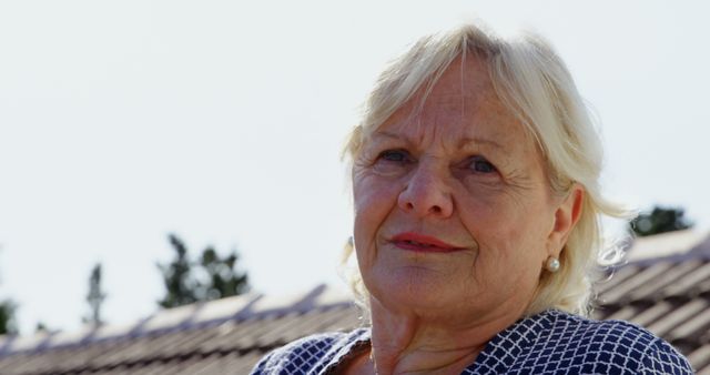 Senior Woman Outdoors Smiling Under Clear Sky - Download Free Stock Images Pikwizard.com