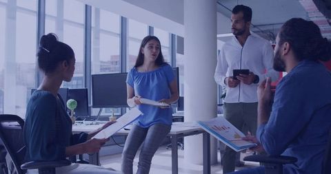 Urban Office Team Collaborating on Business Reports