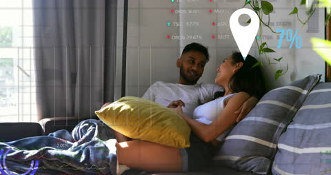Young Couple Relaxing at Home with Virtual Data Overlay