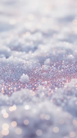 Vertical macro video opening on glistening snow crystals, racking focus to single snowflake