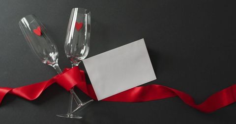 Romantic valentine's day setting with champagne glasses and card