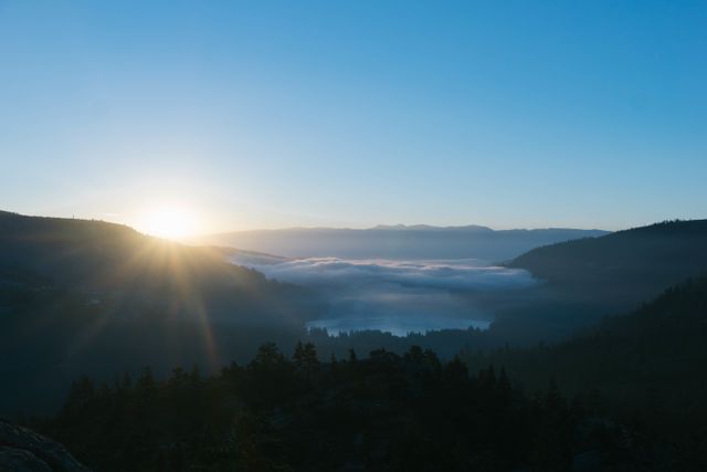 Sunrise Over Misty Mountains and Lake with Clear Sky - Download Free Stock Photos Pikwizard.com