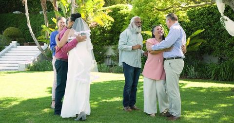Senior Couple Joyfully Celebrating in Lush Garden Wedding