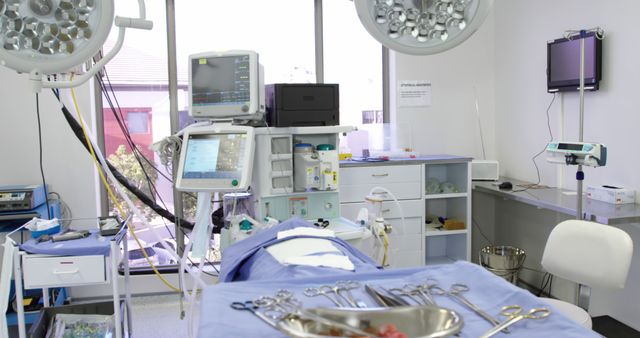 Modern surgical operating room showcasing advanced medical equipment and a sterile environment. This can be used for depicting the advancements in medical technology, healthcare marketing materials, illustrating articles on surgical procedures or hospital facilities, and promoting medical services.