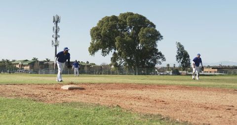 Diverse Baseball Team on Field Practicing Pitches