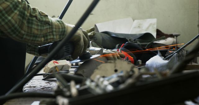 Artisan Using Angle Grinder in Workshop Cutting Metal With Sparks - Download Free Stock Images Pikwizard.com