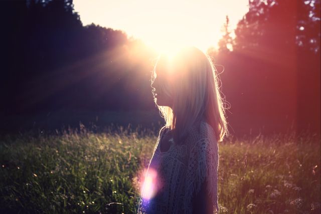 Silhouette of Woman in Sunset Light in Meadow - Download Free Stock Photos Pikwizard.com
