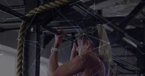 Female Athlete Performing Pull-Up with Smartwatch and Geometric Digital Overlay
