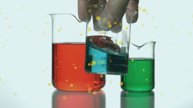 This image shows beakers with vibrant red, blue, and green liquids, combined with a hand manipulating one of the containers, and animated spots overlaid. Ideal for representing scientific research, chemistry education, or digital interface concepts. Suitable for use in science-related websites, educational materials, and innovative technology presentations.