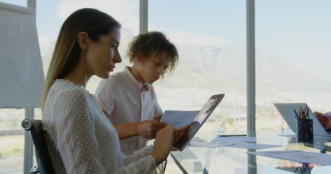 Diverse Business Executives Collaborating in Modern Conference Room