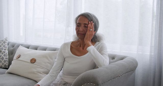 Senior woman experiencing headache at home, looking distressed - Download Free Stock Images Pikwizard.com