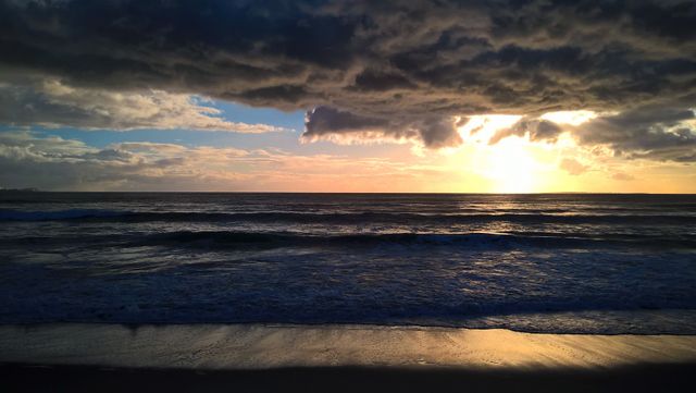 Dramatic Sunset Over Ocean Horizon with Stormy Clouds - Download Free Stock Photos Pikwizard.com