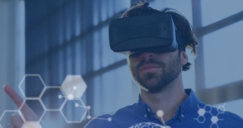 Young Man Exploring Virtual Reality with Scientific Interfaces - Download Free Stock Images Pikwizard.com
