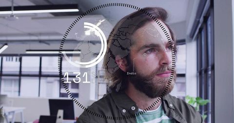 Bearded professional viewing augmented reality hud world map in modern open office