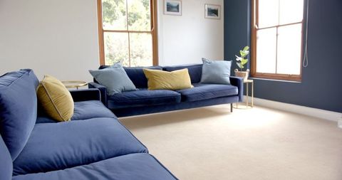 Modern Living Room with Blue Sofas and Decorative Cushions - Download Free Stock Images Pikwizard.com