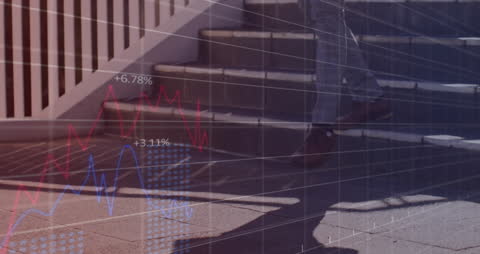 Businessman Walking Up Stairs with Financial Data Overlay