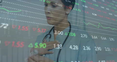 Healthcare Professional Analyzing Financial Data Overlays Within Hospital Setting