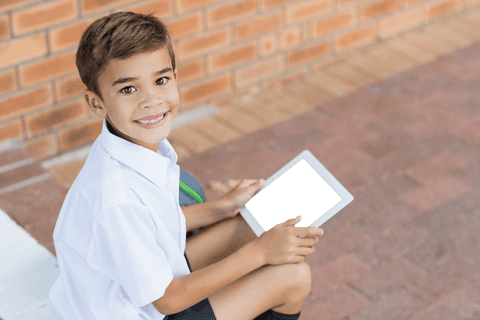 happy boy holding tablet with transparent screen outdoors - Download Free Stock Videos Pikwizard.com