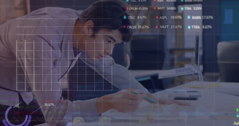 Caucasian Businessman Analyzing Financial Data with Overlay of Stock Statistics