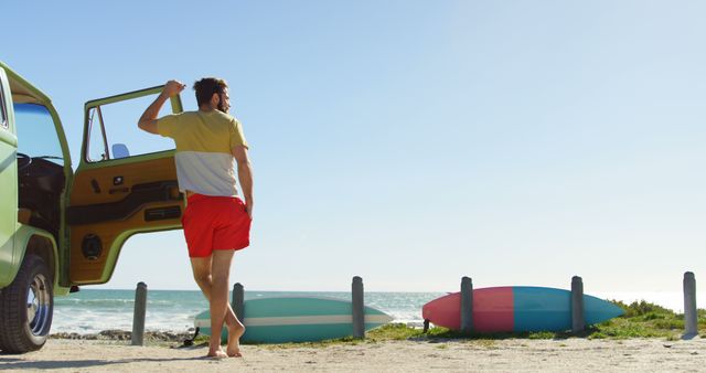 Man Enjoying Beach View Exiting Van on Sunny Day - Download Free Stock Images Pikwizard.com