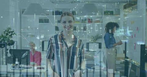 Diverse office team collaborating in modern workspace with financial interface