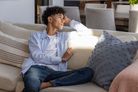Relaxed Teen Contemplating in Modern Living Area