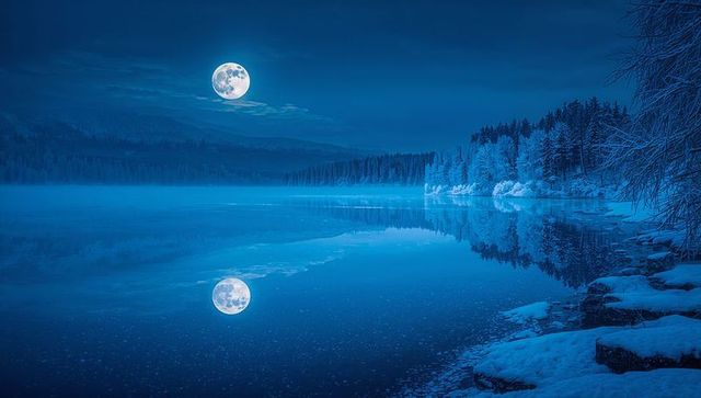 Winter Nightscape with Full Moon Reflecting on Serene Lake