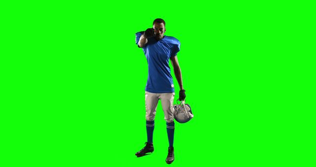 American Football Player in Blue Uniform Holding Helmet Against Green Screen - Download Free Stock Images Pikwizard.com