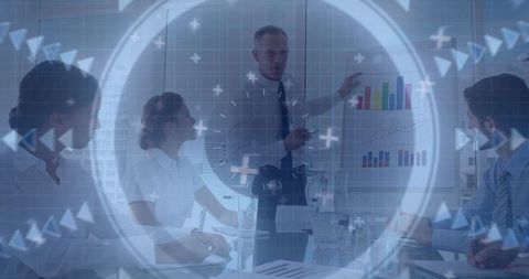 Professional presenting charts to team in conference room