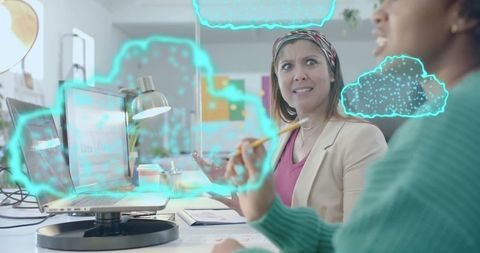 Diverse team analyzing digital cloud data in modern office