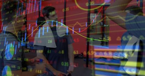 Men working out and discussing stock market data with neon candlestick chart overlay